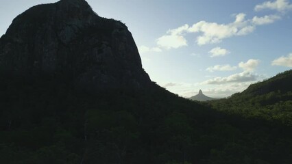 Poster - Landscape view of green hills range of Glass House Mountains with cloudy sky, Australia