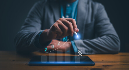 Poster - Business finance and technology concept, Column chart with company progress and growth by year, 2024, businessman calculates financial data for long term investments. Planing, goal, target, strategy