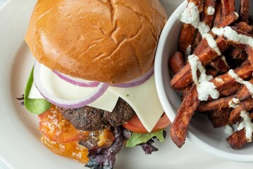 Poster - Closeup of a hamburger and French fries, ready to be enjoyed