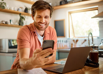 Poster - Happy man, phone and chatting for social media, communication or networking on kitchen table at home. Male person with smile on mobile smartphone app for online browsing, research or texting in house