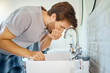 © HockleyMedia/peopleimages.com - Man in bathroom, mouth wash and water with morning routine, health and wellness in home. Dental care, cleaning teeth and face with male grooming for fresh breath, hygiene and getting ready in house.