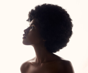 Wall Mural - Hair, silhouette and profile of black woman with afro hairstyle, beauty and skincare on white background. Natural haircare, cosmetics and beautiful face of African model with glow and shine in studio