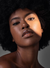 Dark Portrait Light, Makeup Or Black Woman With Beauty Foundation, Natural Facial Cosmetics And Spa Skincare Shine. Studio Lighting, Face Shadow Or African Person With Glowing Skin On Grey Background