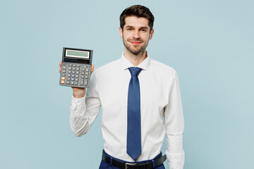 Young fun happy employee business man corporate lawyer wearing classic formal shirt tie work in office use calculator with blank screen isolated on plain pastel light blue background studio portrait.