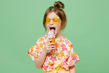 little cute child kid girl 6-7 years old wearing casual clothes sunglasses eat icecream have fun iso