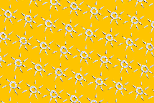 sun pattern drawn with sunscreen on a yellow background