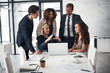 © Thurstan Hinrichsen/peopleimages.com - Meeting, advice and business people with laptop, mentor and planning ideas in collaboration on project proposal. Teamwork, coaching and workshop, men and women with target management in modern office