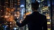 © Valua Vitaly - businessman working with virtual panel and city at background, asian. Businessman pressing high tech type of modern buttons on a virtual background.