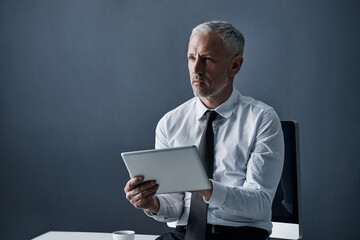 Poster - Tablet, thinking and senior business man online for social media, internet and website at desk. Ideas, corporate worker and mature male person on digital tech for problem solving, email and research
