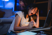 Late-night Freelancer, Dedicated Asian Woman Working Overtime On Laptop Computer, Meeting Deadlines In The Sleepy Night, Businesswoman Burning The Midnight To Working Hard, Sleep At Working Desk
