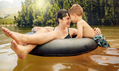 Poster - Lake, inflatable ring and mother with child in water while camping in a forest for vacation or holiday together. Travel, swimming and parent bonding with kid in nature for freedom, love and happiness