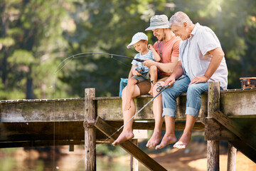 Dad, grandfather and teaching child fishing at lake together for fun bonding, lesson or activity in nature. Father, grandpa and kid learning to catch fish with rod by water pond or river in forest