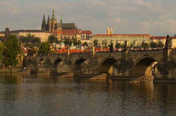 Wall Mural - Classic cityscape view of medieval Prague. Panorama of ancient Prague Castle and Saint Vitus Cathedral. Famous Charles Bridge (Karluv Most) over Vltava River. UNESCO World Heritage Site