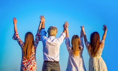 Group, hands up back. Group of women, man enjoying and together saying hello. Young people leisure activity, all hands up. Group male, girls standing together holding hands, raise their hands up