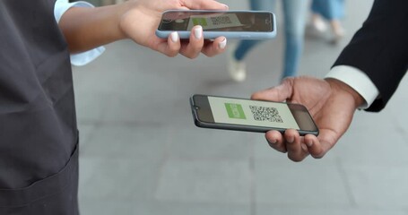 Cropped shot of restaurant worker scanning qr code of vaccination digital passport on smartphone app