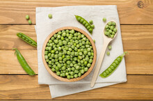 Composition With Fresh Green Peas On Wooden Background, Top View