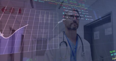 Canvas Print - Animation of graphs and trading board over low angle view of caucasian doctor walking in corridor