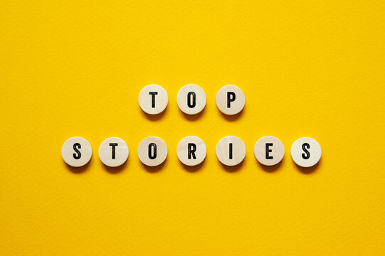 Top stories - word concept on building blocks, text