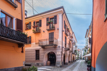 Wall Mural - Cuneo, Piedmont, Italy: Contrada Mondovì, ancient street in the historic center with decorated nineteenth-century buildings with arcades