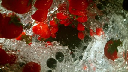 Poster - Super Slow Motion of Water Wave with Berries Fruit. Water Surf Wave Rotating Around and Creating Tunnel Shape. Filmed on high speed cinema camera, 1000 fps.