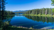 Tranquil morning reflecting on lake at William a Switzer Provincial Park, Alberta
