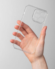 Leinwandbilder - Hand holding mobile phone case, transparent smartphone protection