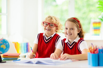 Wall Mural - Kids doing homework. Children go back to school.