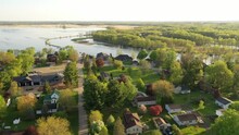 Aerial View Of Fremont, Wisconsin: Houses, River, Boats. Serene, Picturesque Town Blending Nature, Suburban Charm, And Riverside Living. Explore The Beauty From Above