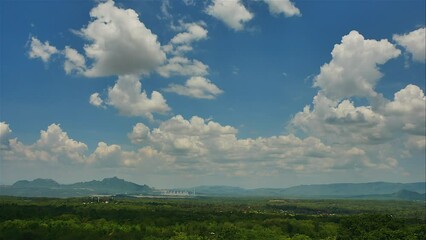Wall Mural - time-lapse of a white fluffy cumulus cloud in the blue sky