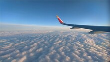 Timelapse Plane Window View Plane Wing Flying Over Sea Of Clouds On A Sunny Afternoon
