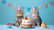 two cat wearing birthday cap with birthday cake and candles on blue background created with Generative AI 