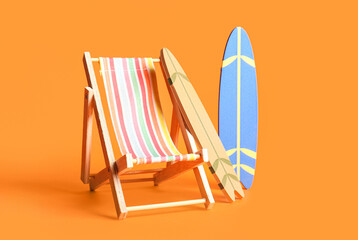 Wall Mural - Composition with mini surfboards and deckchair on orange background