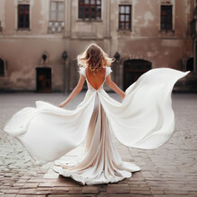 Stunning Woman A Beautiful White Dress In An Empty Old Town Square, View From The Back, Generative AI Illustration