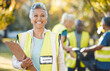 © Wesley JvR/peopleimages.com - Clipboard, volunteering portrait and woman in park cleaning, community service and pollution or waste checklist. Pollution, inspection and senior person or manager in ngo or nonprofit project outdoor