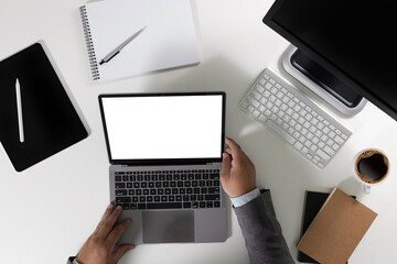 men using laptop computer working at office workspace with blank display white desktop screen monitor frame empty mockup for copy template advertising communication space