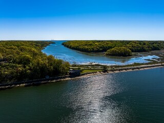 Canvas Print - Aerial view over the calm waters in Oyster Bay near Lloyd Harbor, New York on a sunny day