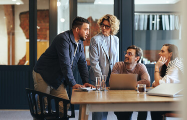 Team of professionals having a meeting in a digital marketing agency