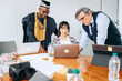 © jaimelafrickmartial  - colleagues of different ages multiethnic consultants discussing company financial strategy.