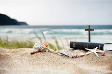 Church Summer Retreat Concept With Bible Book, Cross Of Jesus Christ And Shells, Conch And Starfish On Sandy Beach And Sea With Waves Summer Bible School Summer Camp Background
