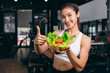 asian young sport woman in fitness sport club with healthy food eating vegetables mix salad diet low calories
