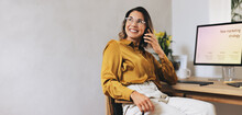 Thoughtful Businesswoman Strategizing Marketing Campaign Through Phone Call