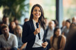 © Creative Clicks - Corporate business woman giving a presentation at a professional conference seminar,