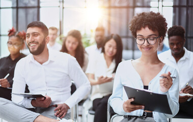 people sitting in business seminar room in hotel business