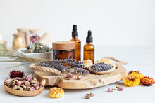 Botanical Blends, Herbs, Essencial Oils For Naturopathy. Natural Remedy, Herbal Medicine, Blends For Bath And Tea On Wooden Table Background