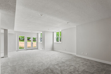 Wall Mural - empty room with a window. freshly painted white walls and brand new nylon carpeting in the room