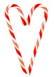 Red and white candy canes in a heart shape isolated on a white background.