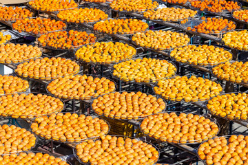 Sticker - Peeled persimmons drying at outdoor