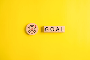 virtual target board and goal word on wooden blocks, business achievement goal and objective target,