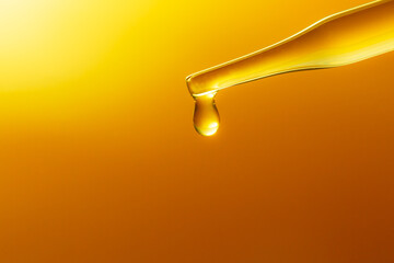 Wall Mural - yellow science test tube,dropping yellow chemical liquid or essential oil to test tube on white back