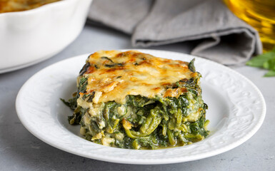 Wall Mural - Baked Spinach with cheese delicious Italian food cuisine. Spinach gratin.